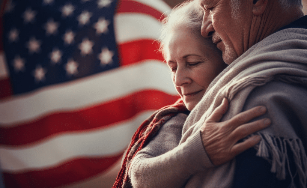 Veteran and spouse honoring the flag